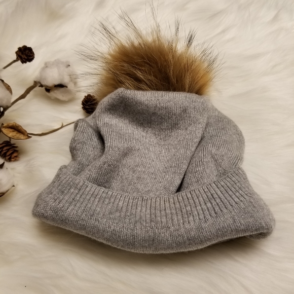 hat with fur ball on top